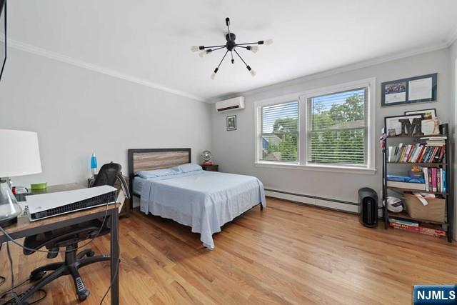 364 Rutland Avenue Teaneck, NJ 07666 - Photo 23 of 29 a bedroom with a bed and a window