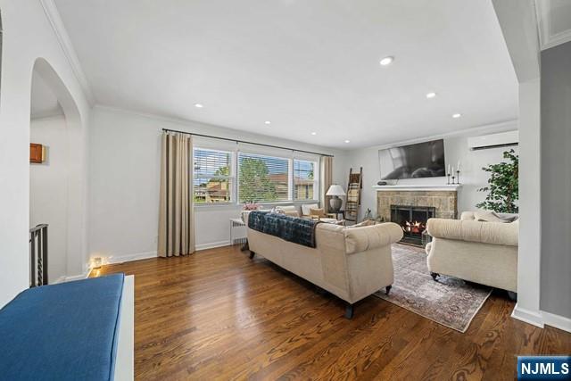 364 Rutland Avenue Teaneck, NJ 07666 - Photo 8 of 29 a living room with furniture and a fireplace