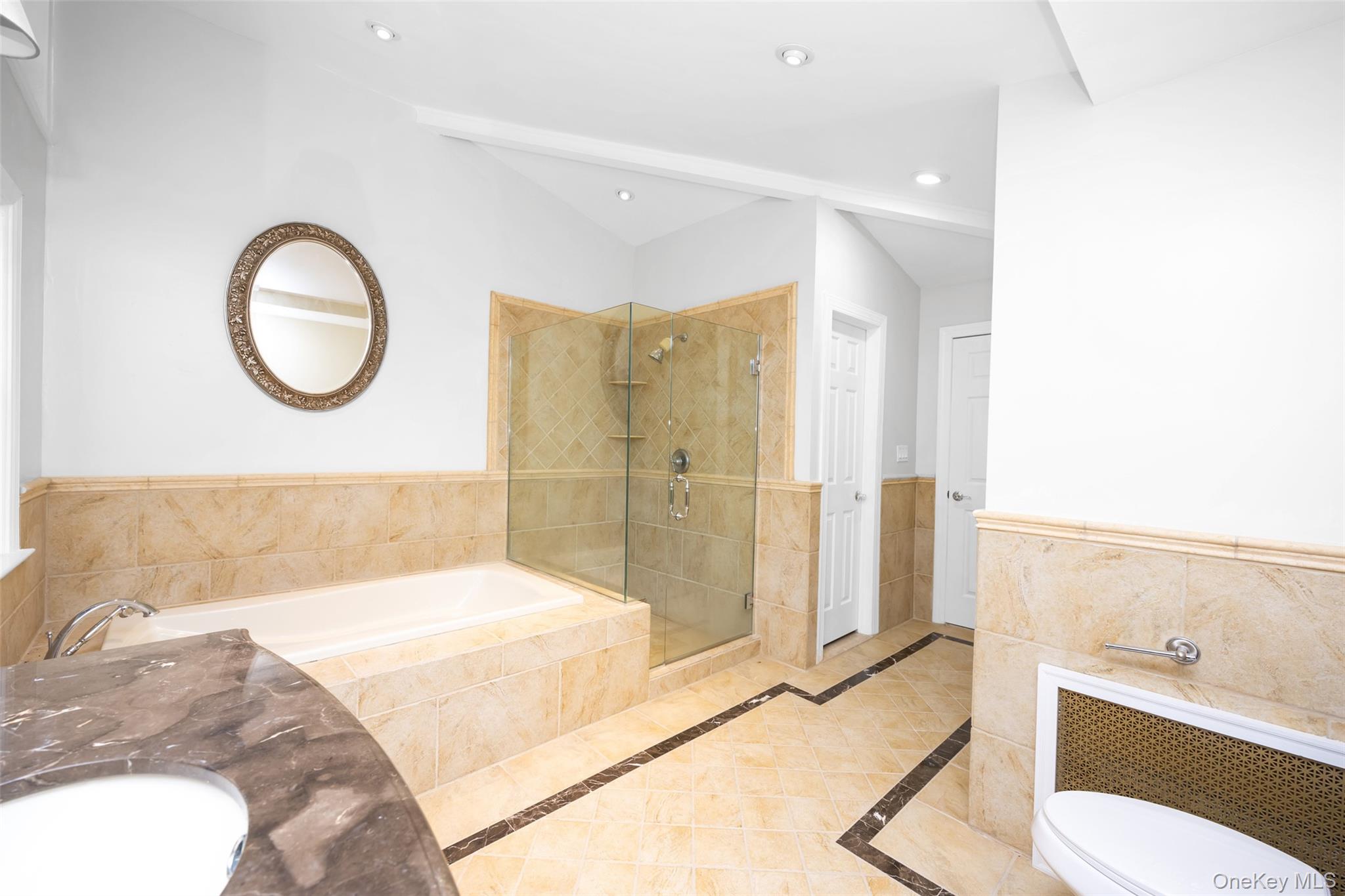 36 Red Spring Lane Glen Cove, NY 11542 - Photo 12 of 33 Bathroom – Featuring wainscoted walls, a shower stall, bathtub, inlaid flooring, and recessed lighting.