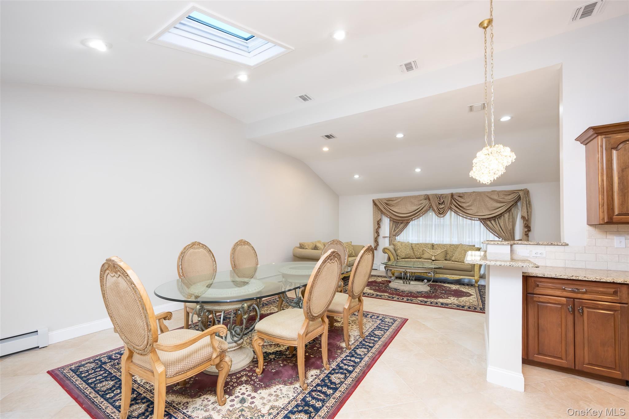 36 Red Spring Lane Glen Cove, NY 11542 - Photo 6 of 33 Dining area – Open space adjacent to the kitchen, featuring skylights, recessed lighting, and French doors that lead to the rear deck.