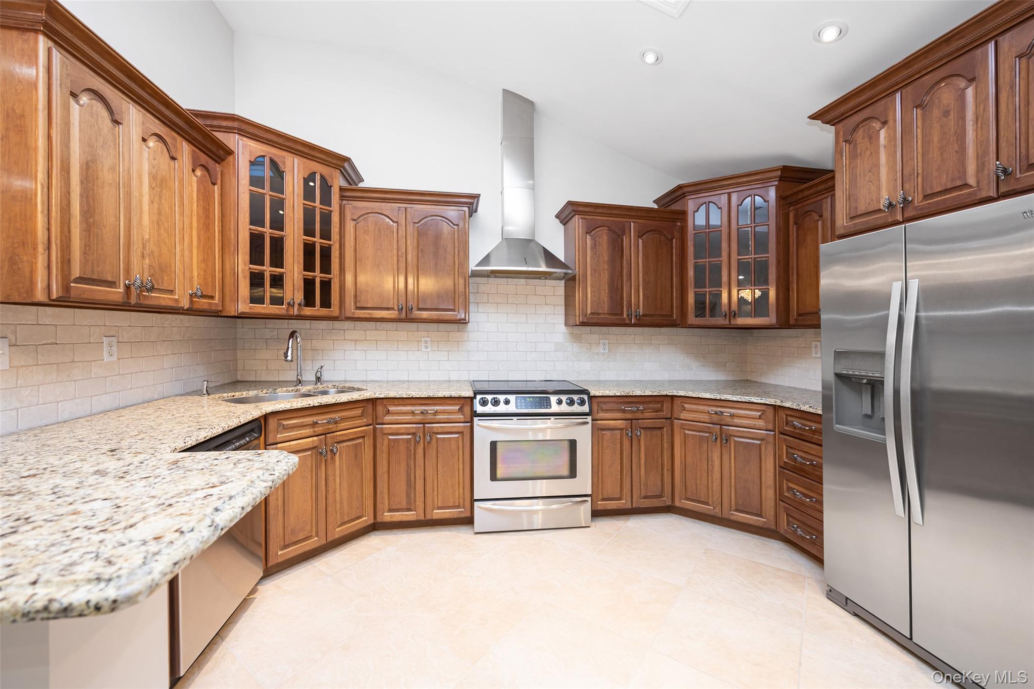 36 Red Spring Lane Glen Cove, NY 11542 - Photo 7 of 33 Kitchen (Alternate View) – A closer look at the kitchen’s detailed craftsmanship, tile backsplash, and ample counter space designed for both cooking and entertaining.
