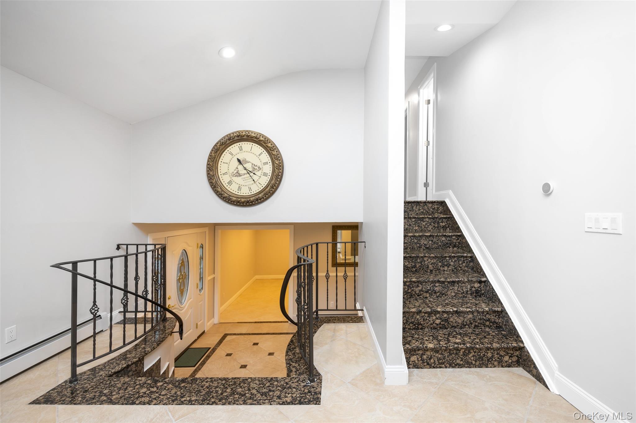 36 Red Spring Lane Glen Cove, NY 11542 - Photo 9 of 33 Stairway featuring tile patterned floors, recessed lighting, and lofted ceiling