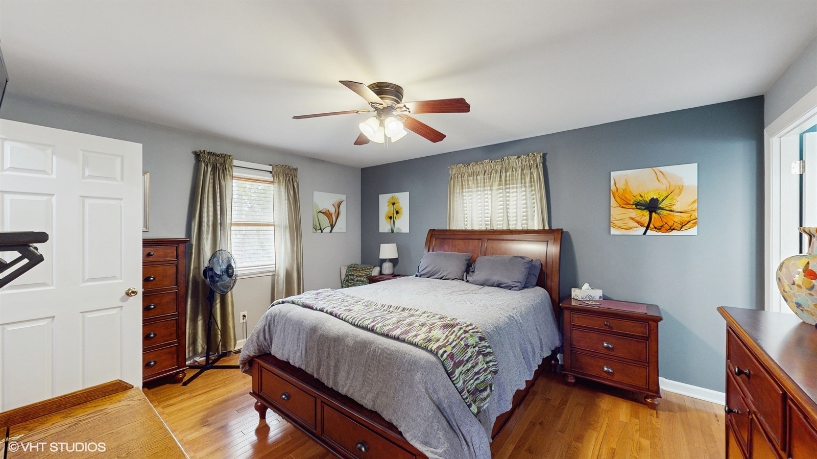 2606 Martin Drive Spring Grove, IL 60081 - Photo 12 of 32 a bedroom with a bed and a chandelier