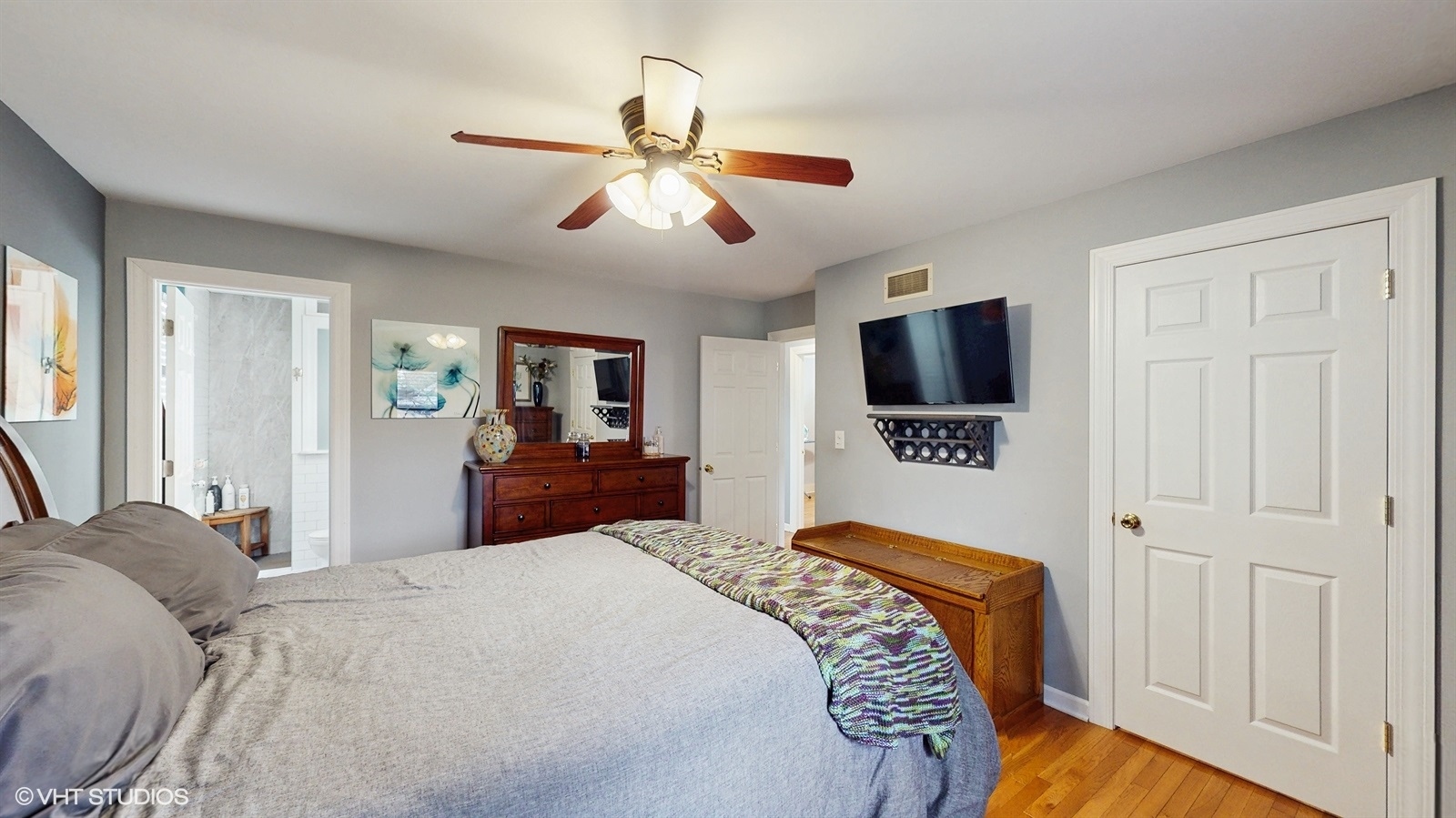 2606 Martin Drive Spring Grove, IL 60081 - Photo 13 of 32 a bedroom with a bed and a flat tv screen on dresser