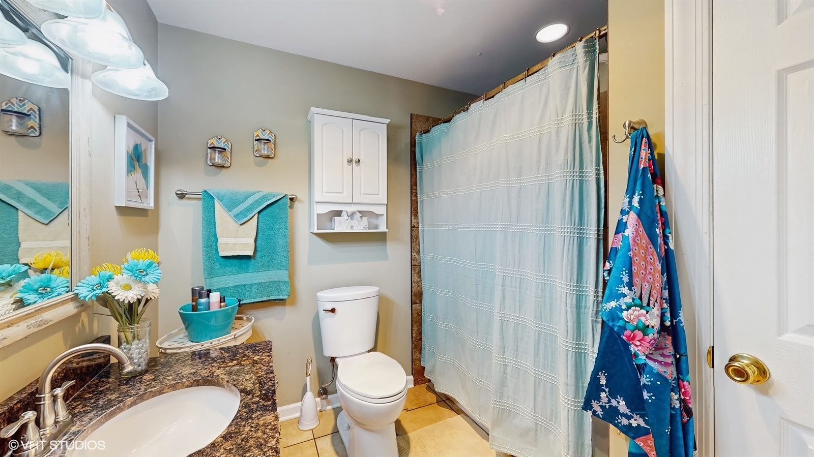 2606 Martin Drive Spring Grove, IL 60081 - Photo 16 of 32 a bathroom with a granite countertop toilet and a sink