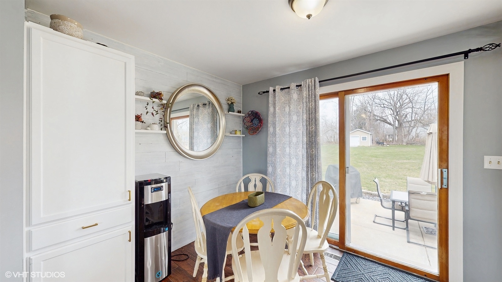 2606 Martin Drive Spring Grove, IL 60081 - Photo 4 of 32 a view of a dining room with furniture large window and wooden floor