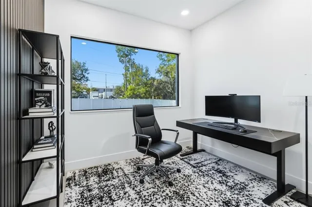 a workspace with furniture and window