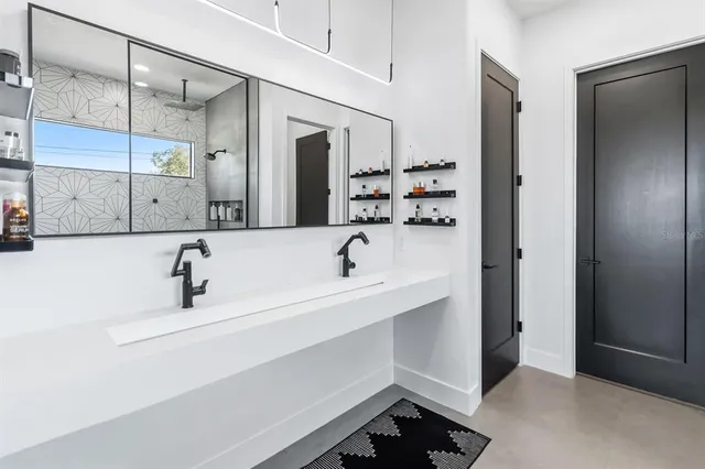 a bathroom with a sink and a mirror