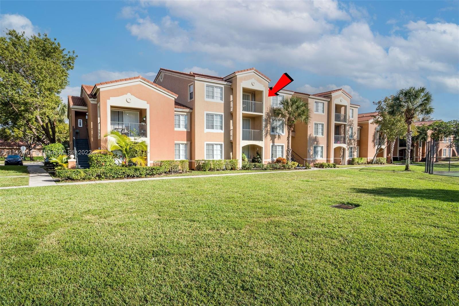 8030 North Nob Hill Road, Unit 306 Tamarac, FL 33321 - Photo 1 of 26 a front view of house with yard