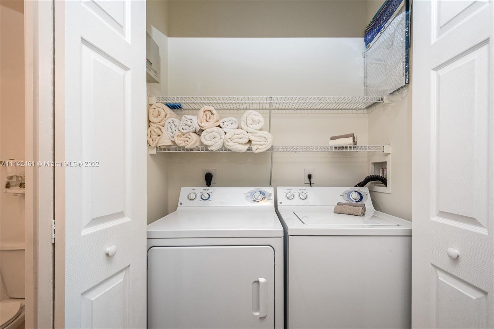 8030 North Nob Hill Road, Unit 306 Tamarac, FL 33321 - Photo 18 of 26 a utility room with dryer and washer