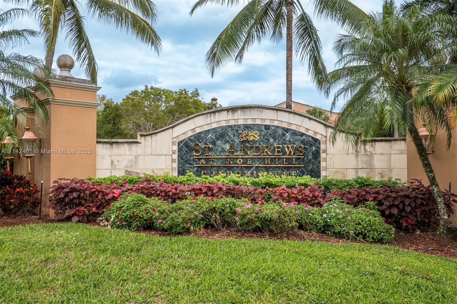 8030 North Nob Hill Road, Unit 306 Tamarac, FL 33321 - Photo 19 of 26 a front view of multi story residential apartment building with a yard