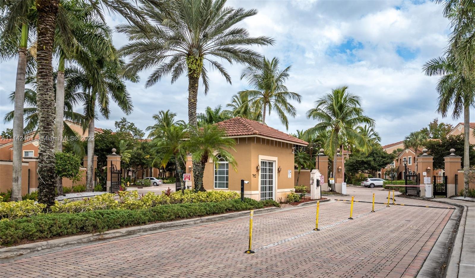 8030 North Nob Hill Road, Unit 306 Tamarac, FL 33321 - Photo 24 of 26 a view of a house with a patio