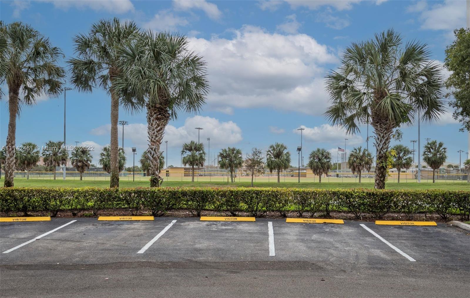 8030 North Nob Hill Road, Unit 306 Tamarac, FL 33321 - Photo 26 of 26 a view of a park with big trees