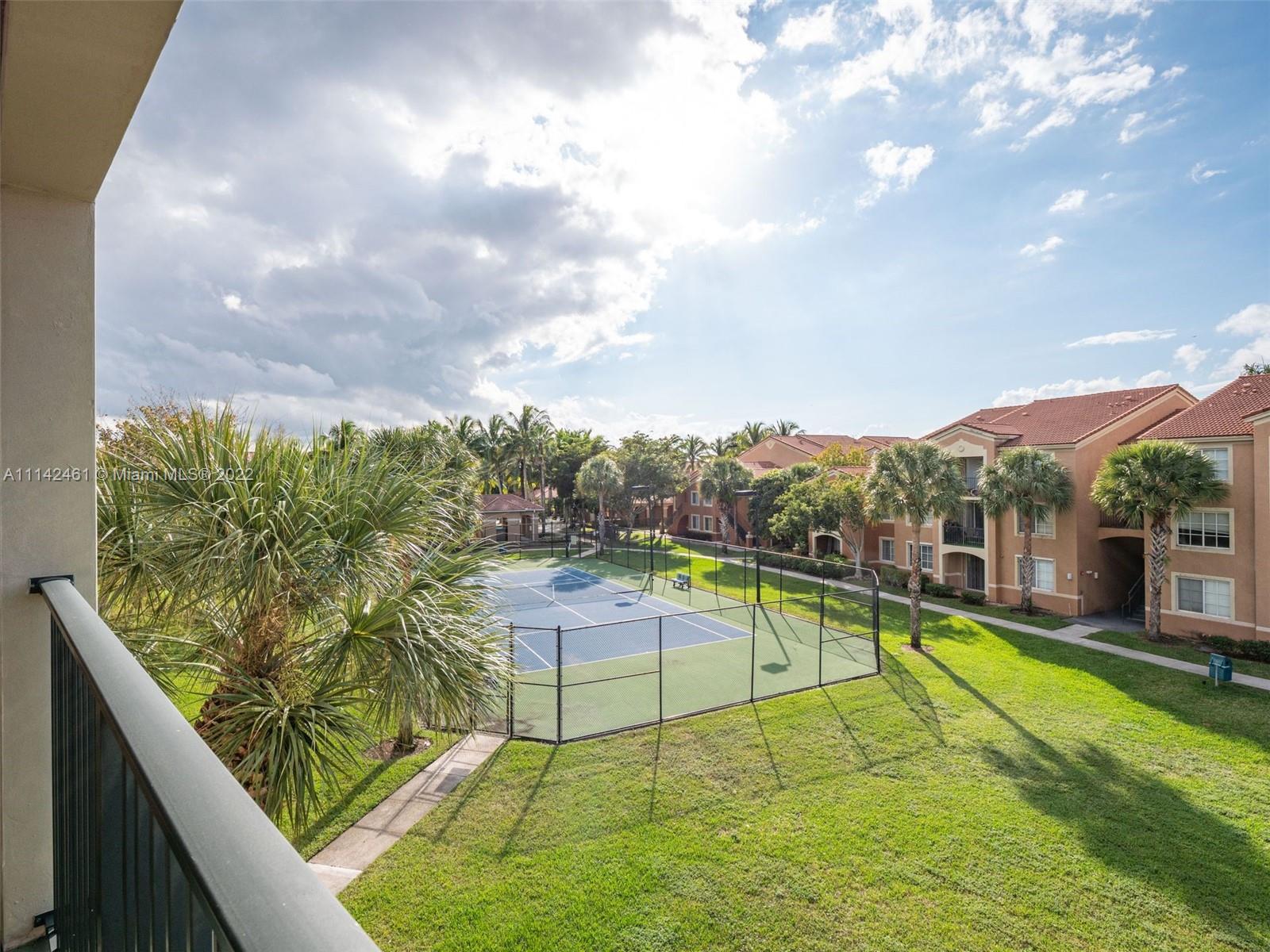 8030 North Nob Hill Road, Unit 306 Tamarac, FL 33321 - Photo 6 of 26 a view of a swimming pool with a lounge chairs