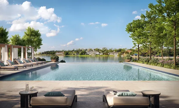 a view of a lake with couches in the patio