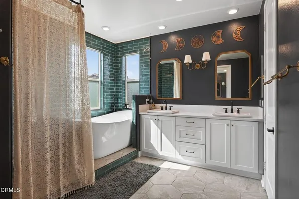 a bathroom with a sink and a large mirror