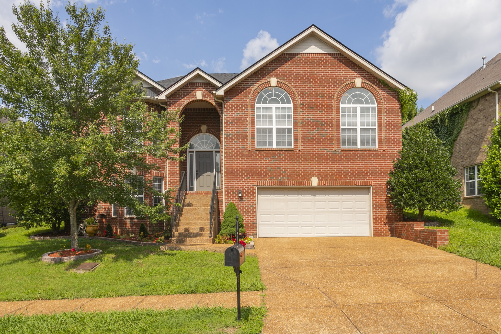 7337 Campton Road Nashville, TN 37211 - Photo 1 of 53 a front view of a house with a yard and garage
