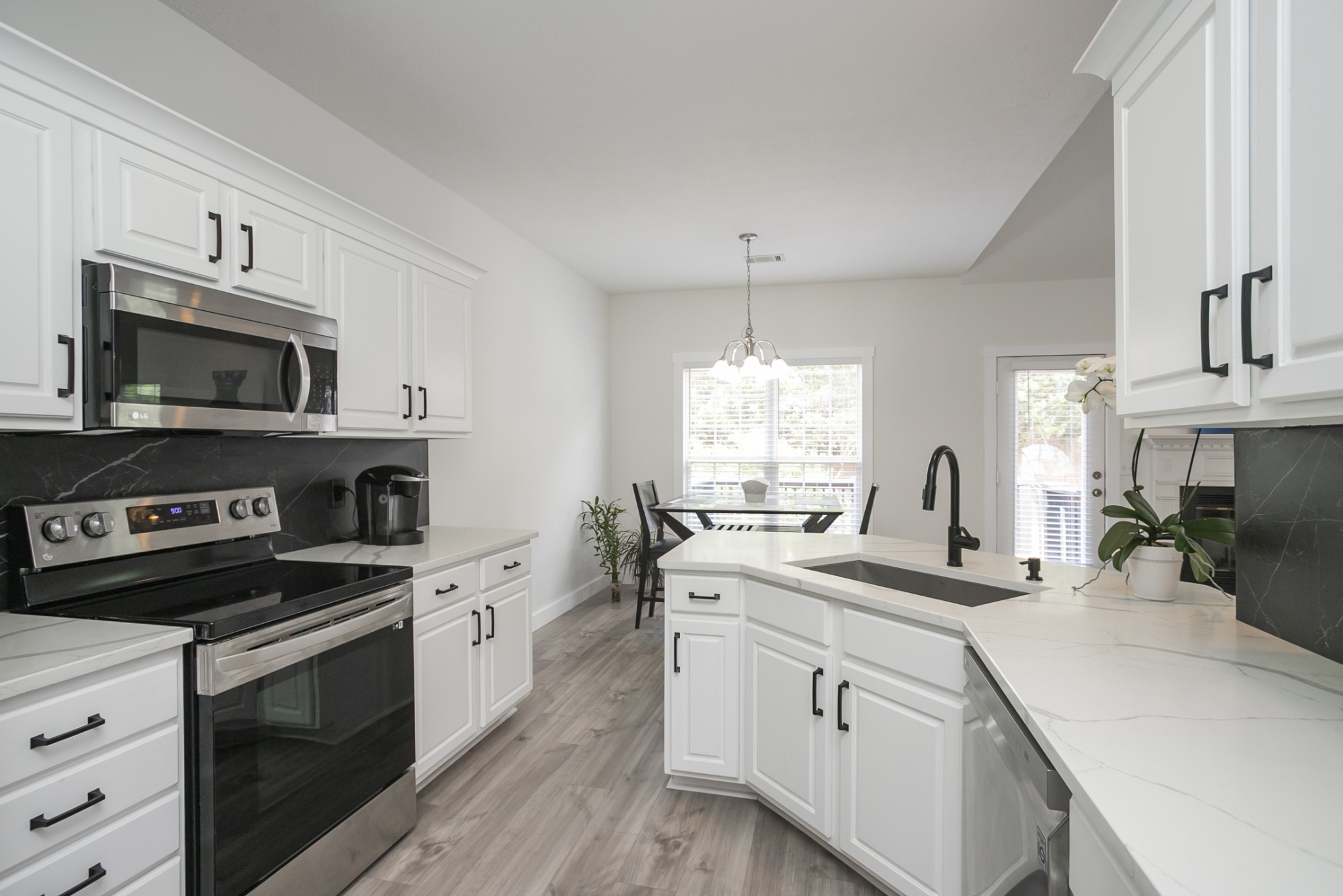 7337 Campton Road Nashville, TN 37211 - Photo 16 of 53 a kitchen with a sink stove and microwave
