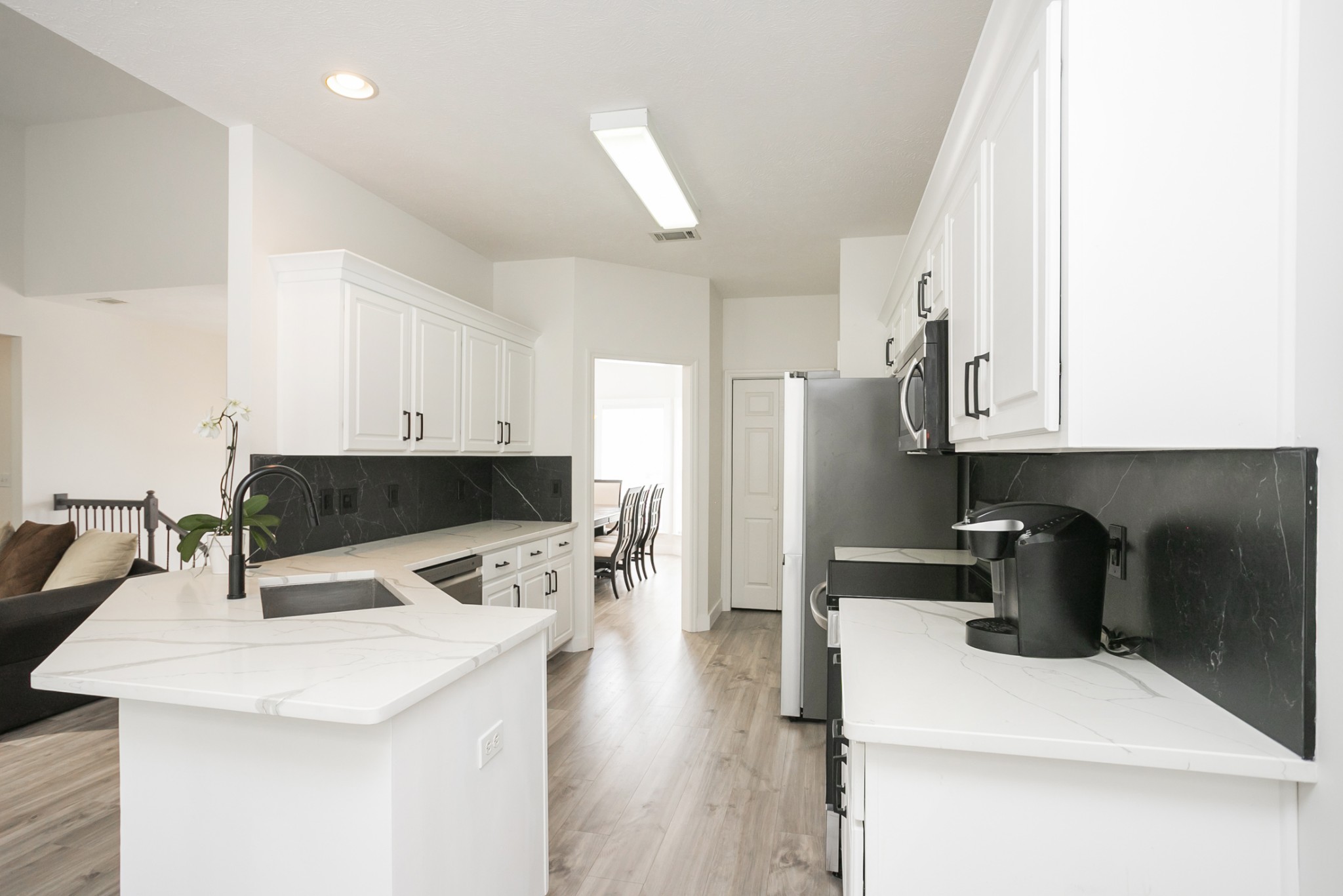 7337 Campton Road Nashville, TN 37211 - Photo 17 of 53 a kitchen with stainless steel appliances a sink a stove a refrigerator and cabinets