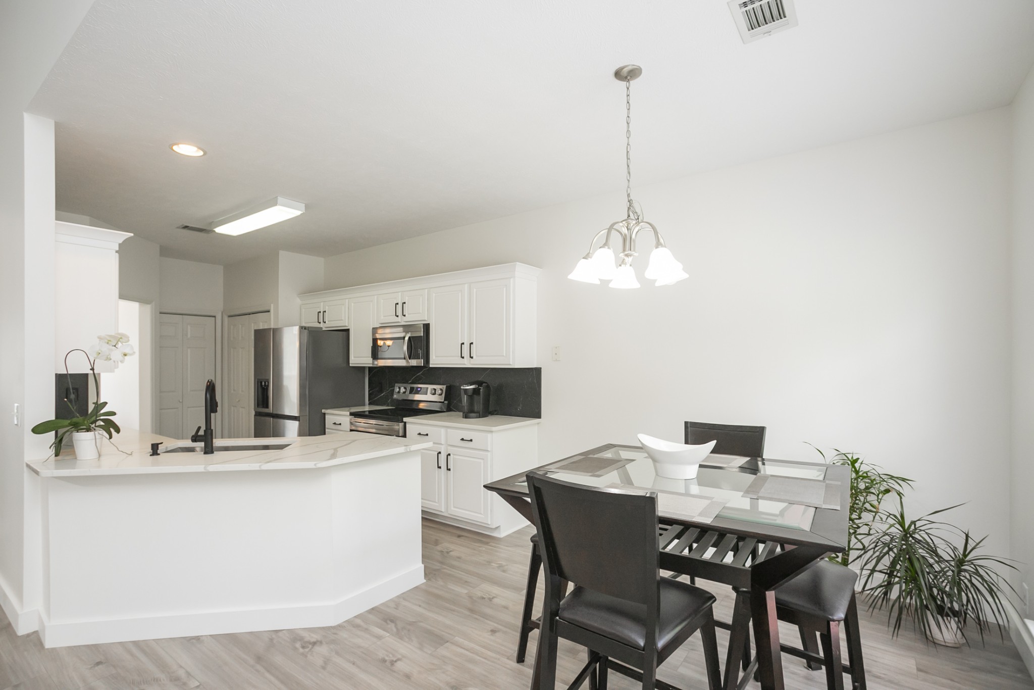 7337 Campton Road Nashville, TN 37211 - Photo 20 of 53 a dining room with stainless steel appliances kitchen island granite countertop a dining table chairs and a kitchen view