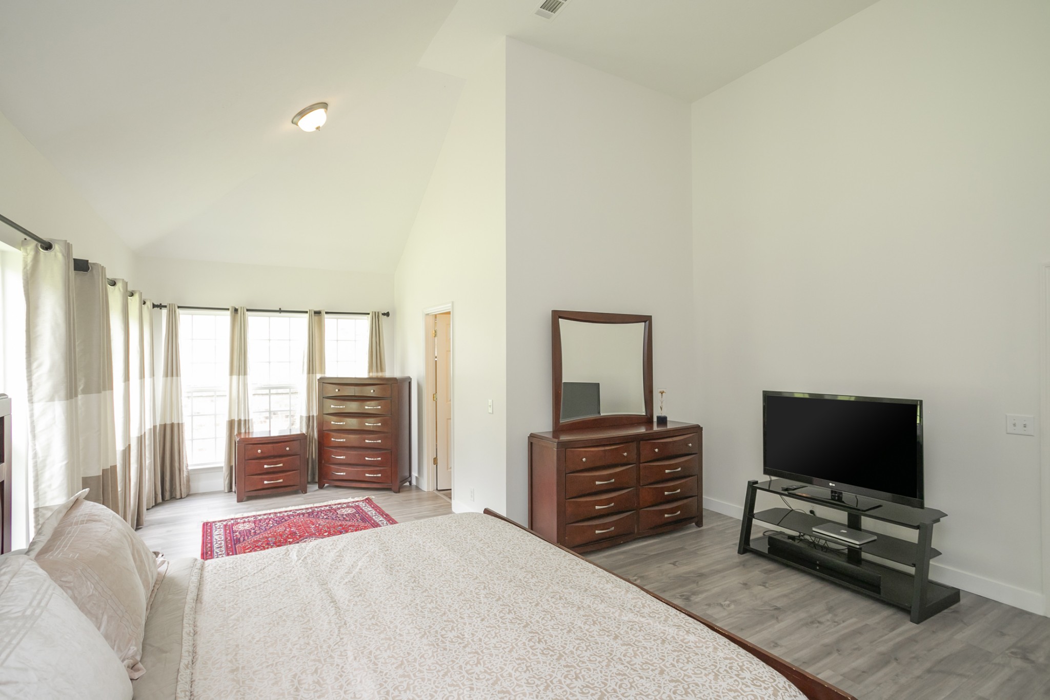 7337 Campton Road Nashville, TN 37211 - Photo 25 of 53 a bedroom with a bed and a flat screen tv