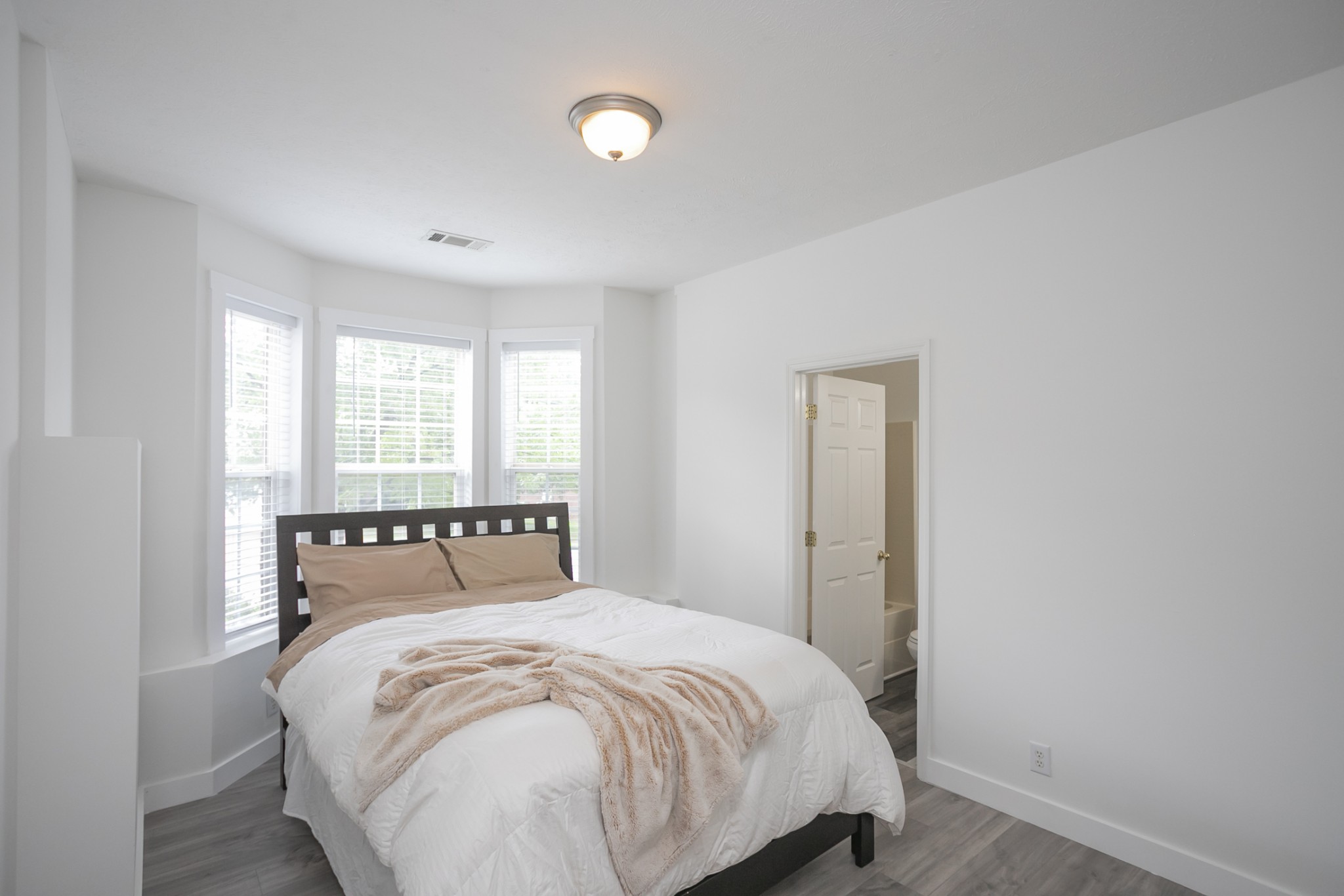 7337 Campton Road Nashville, TN 37211 - Photo 39 of 53 a large bed sitting in a bedroom next to a window and a larger closet