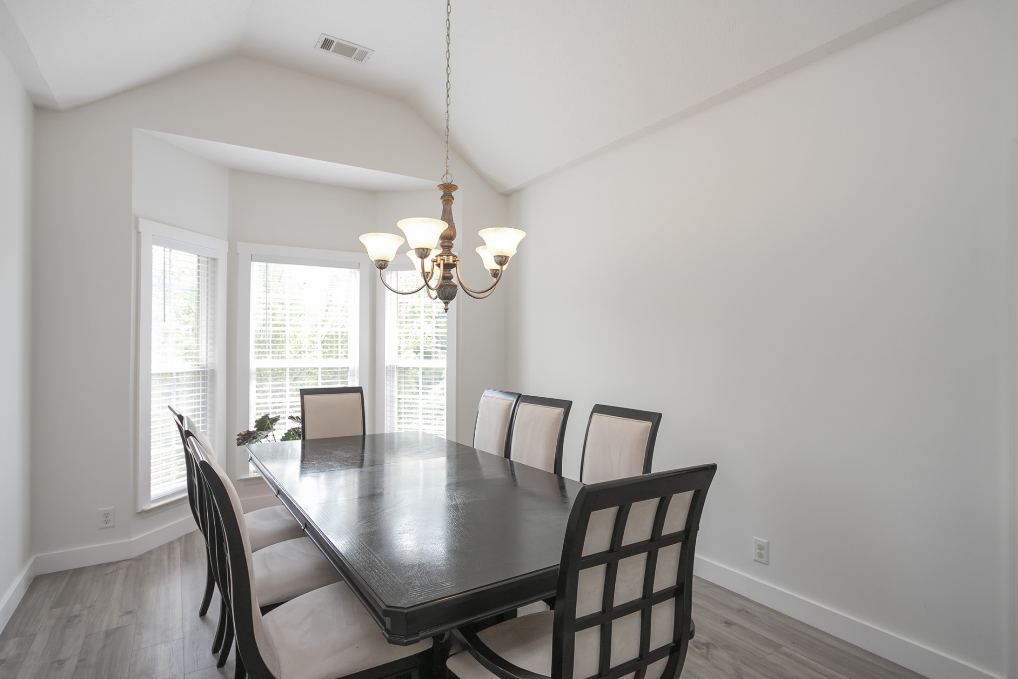 7337 Campton Road Nashville, TN 37211 - Photo 6 of 53 a view of a dining room with furniture a chandelier and wooden floor