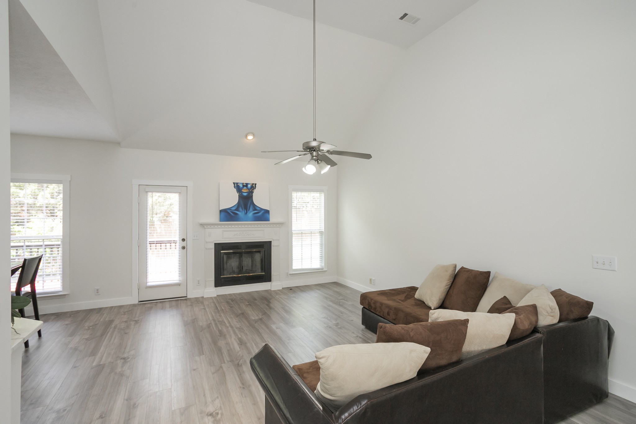 7337 Campton Road Nashville, TN 37211 - Photo 8 of 53 a living room with furniture a fireplace and a flat screen tv