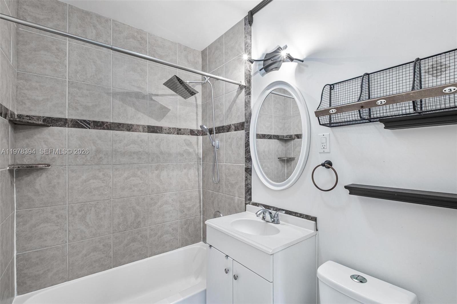 2862 Southwest 38th Court Miami, FL 33134 - Photo 19 of 67 a bathroom with a sink a toilet and shower