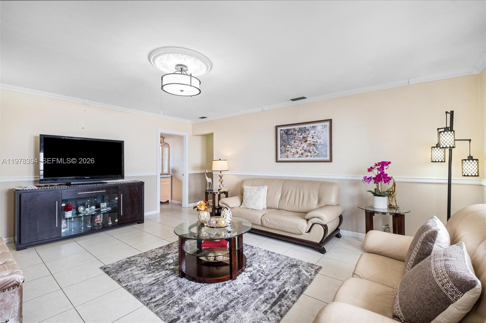 2862 Southwest 38th Court Miami, FL 33134 - Photo 22 of 67 a living room with furniture and a flat screen tv