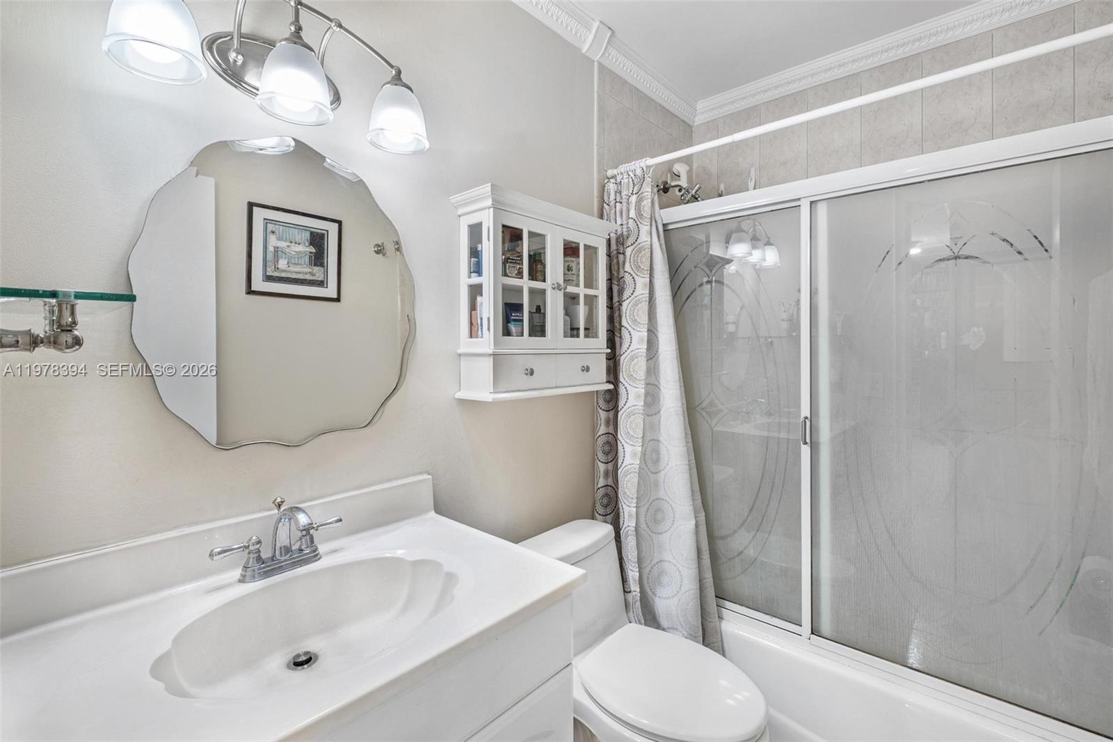 2862 Southwest 38th Court Miami, FL 33134 - Photo 26 of 67 a bathroom with a toilet a sink and a mirror