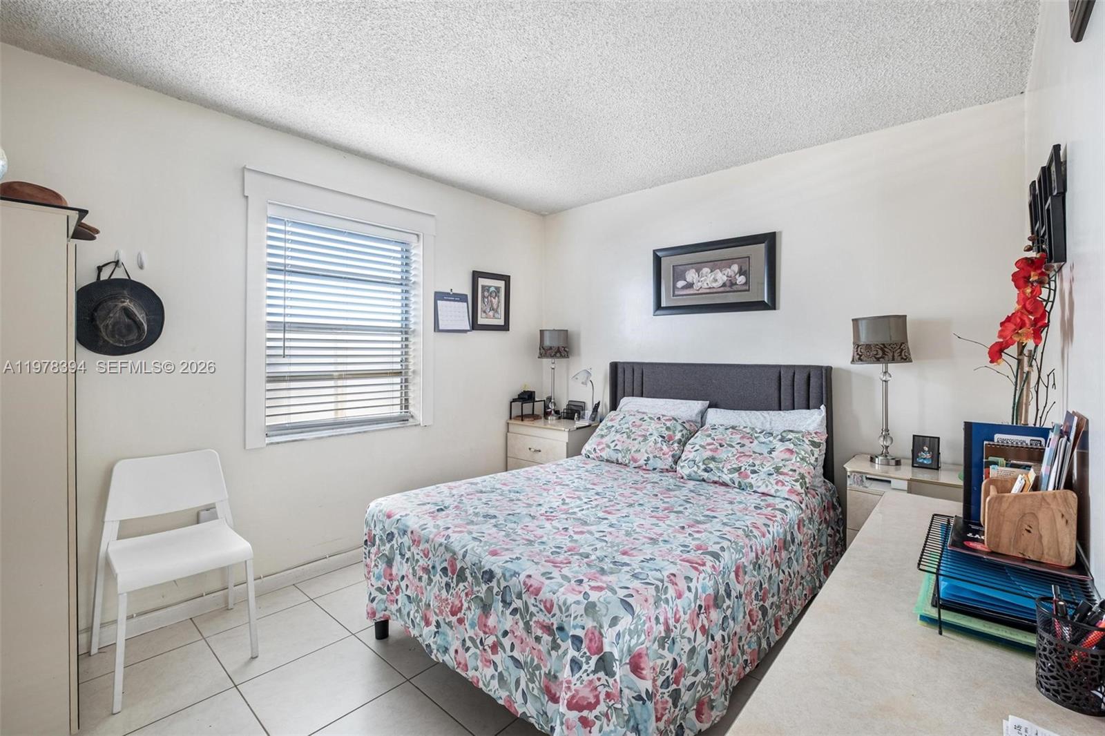 2862 Southwest 38th Court Miami, FL 33134 - Photo 27 of 67 a bedroom with a bed a couch and a window