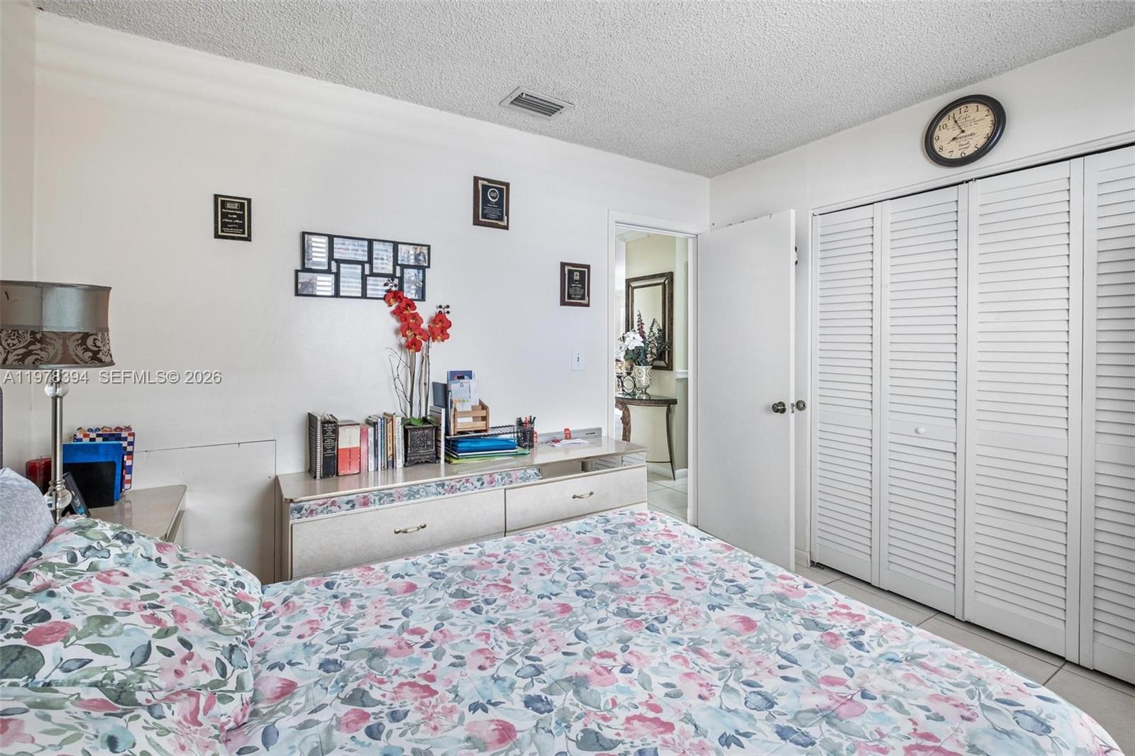 2862 Southwest 38th Court Miami, FL 33134 - Photo 28 of 67 a bedroom with a bed and a dresser in it