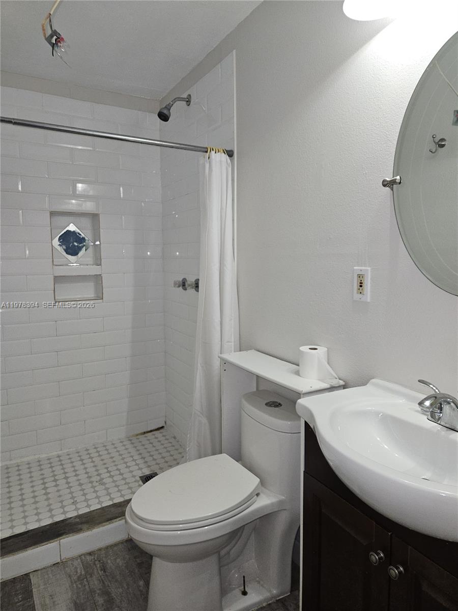 2862 Southwest 38th Court Miami, FL 33134 - Photo 38 of 67 a bathroom with a sink toilet and shower