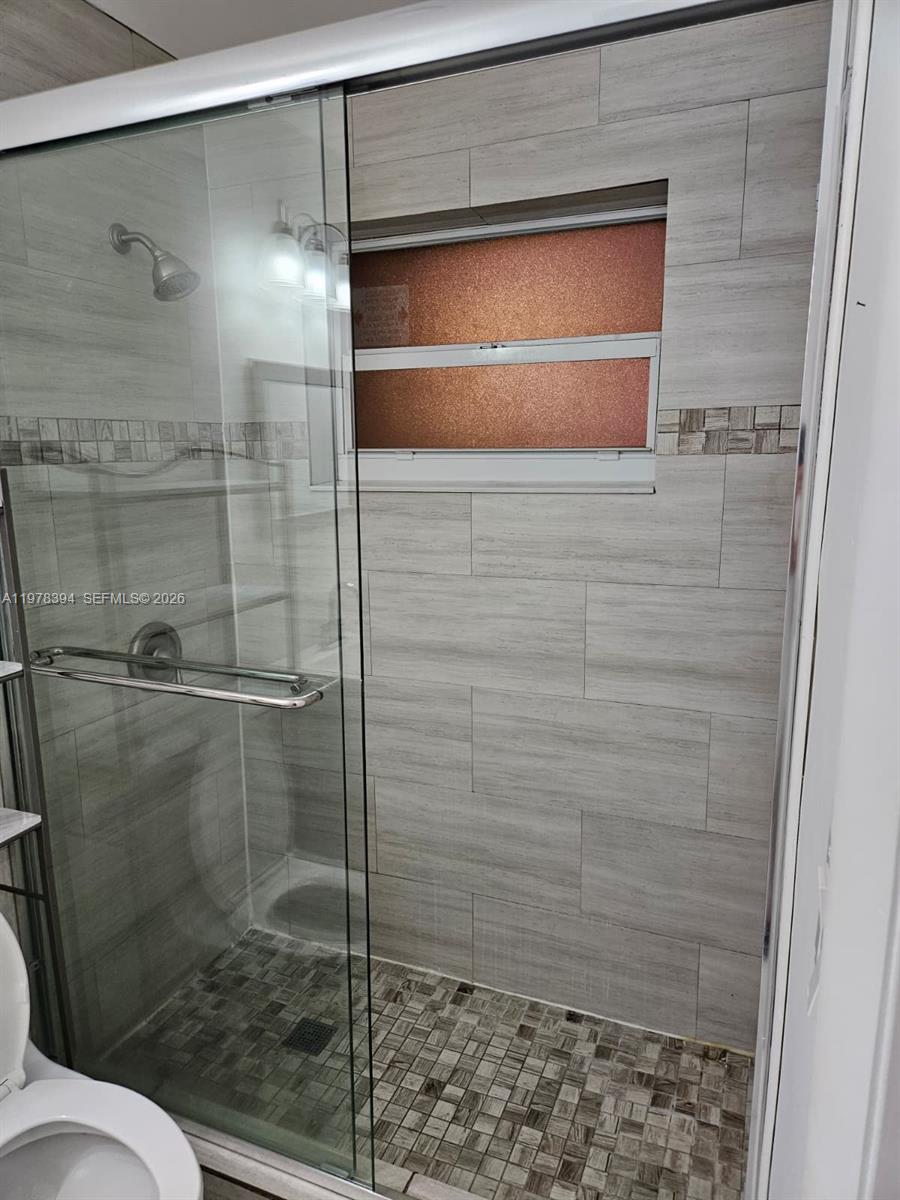 2862 Southwest 38th Court Miami, FL 33134 - Photo 40 of 67 a bathroom with a shower