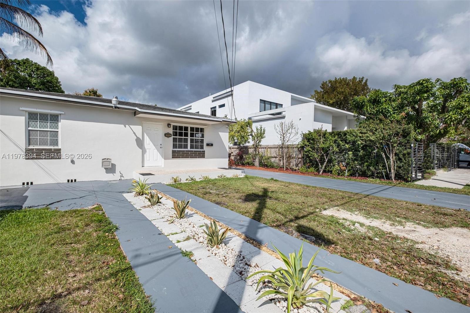 2862 Southwest 38th Court Miami, FL 33134 - Photo 4 of 67 a front view of a house with garden