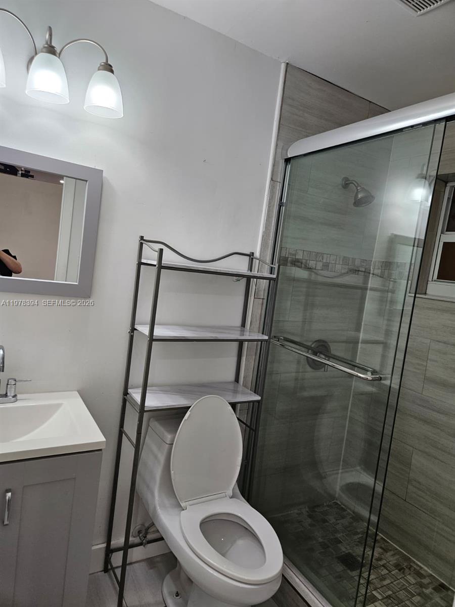 2862 Southwest 38th Court Miami, FL 33134 - Photo 44 of 67 a bathroom with a toilet and a sink