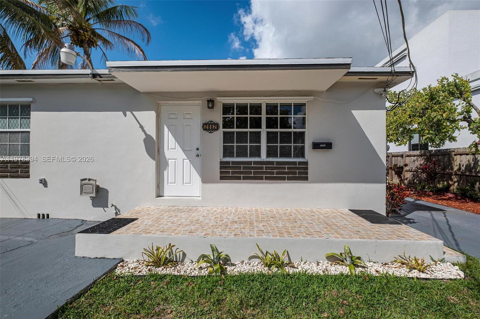 2862 Southwest 38th Court Miami, FL 33134 - Photo 5 of 67 a front view of a house with a yard