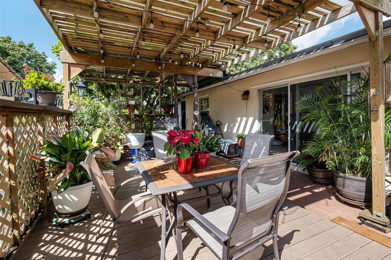 2862 Southwest 38th Court Miami, FL 33134 - Photo 55 of 67 a view of a chairs and table in a patio