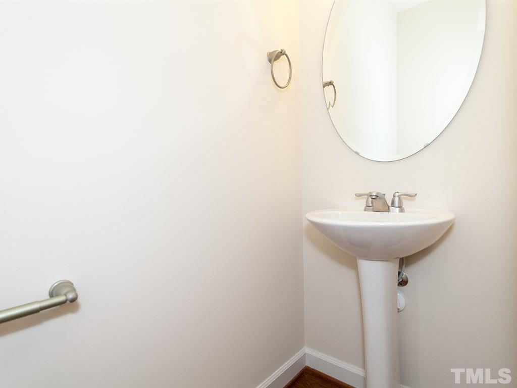 2424 Pecan Ridge Way Apex, NC 27502 - Photo 13 of 21 First Floor Hall Bath is tucked away. Not actual Home. Pictures are of same floorplan in community