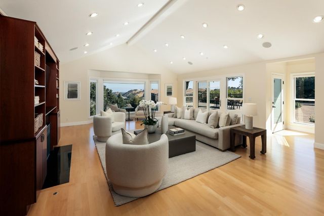 a living room with fireplace furniture and a flat screen tv
