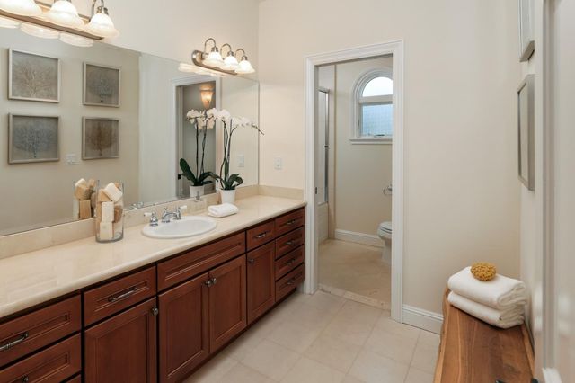 a bathroom with a sink double vanity and a mirror