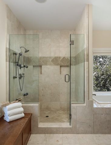 a bathroom with a shower and a bathtub