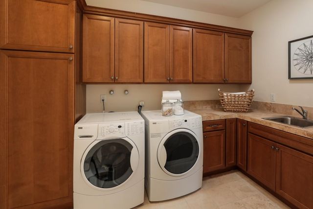 a spacious bedroom with a bed and a couch