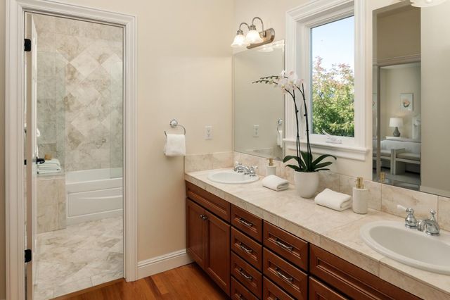 a bathroom with a bathtub and a shower