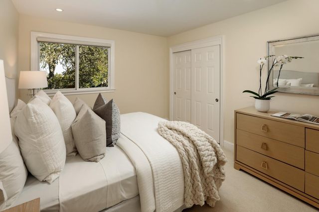 a bathroom with a granite countertop sink a toilet and shower
