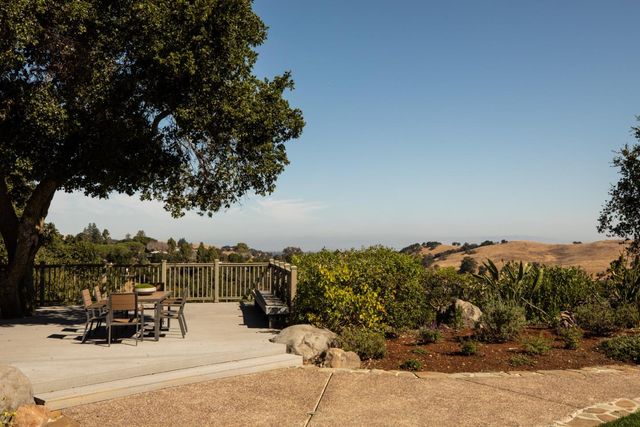 a view of a balcony with furniture