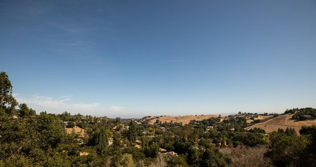 a view of a town with mountains in the background