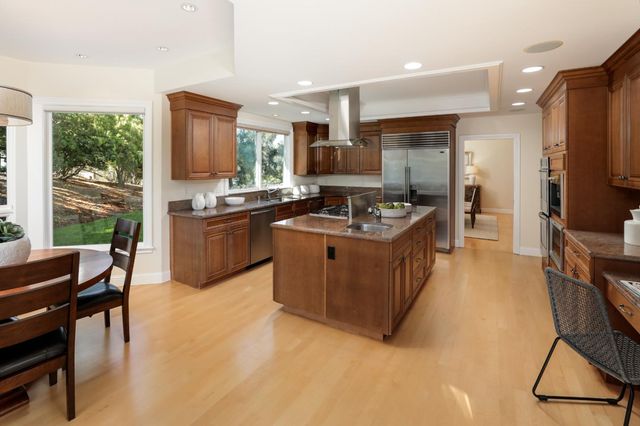 a kitchen with a sink stove and refrigerator