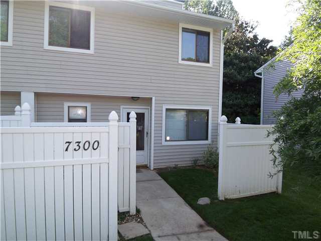 7300 Sandy Creek Drive Raleigh, NC 27615 - Photo 1 of 25 a front view of a house with a yard